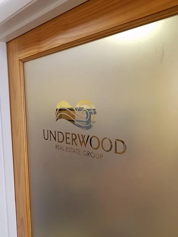 underwood real estate group door glass etching by elite sign services